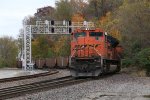 BNSF 9380, the rear DPU, follows along as it comes off the switch to the Hannibal Sub